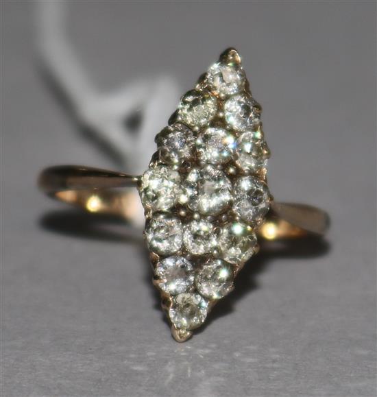 An early 20th century gold and diamond set marquise shaped ring, size M.